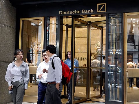 People leave Deutsche Bank in New York.
