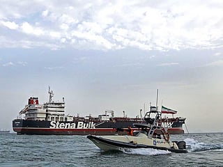 File picture: Iranian Revolutionary Guards patrolling around the British-flagged tanker Stena Impero as it's anchored off the Iranian port city of Bandar Abbas.