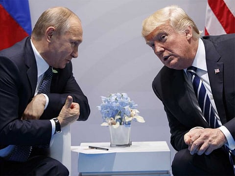File picture of US President Donald Trump, right, with Russian President Vladimir Putin in Germany. Trump made the determination that the United States would terminate adherence to the 1987 arms control accord, senior administration officials told reporters.