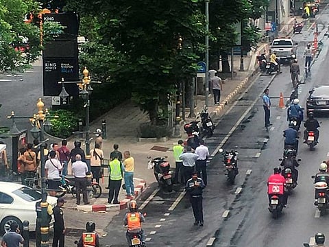 A crowd gathers near the site where explosions were heard in Bangkok, Thailand, on August 2, 2019, in this image obtained via social media. 