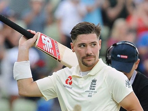 England's Rory Burns acknowledges the crowd as he leaves the field at the end of the second day of the first Ashes Test cricket match between England and Australia at Edgbaston in Birmingham, England