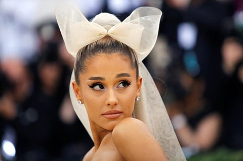 FILE PHOTO: Singer Ariana Grande arrives at the Metropolitan Museum of Art Costume Institute Gala (Met Gala) to celebrate the opening of “Heavenly Bodies: Fashion and the Catholic Imagination” in the Manhattan borough of New York, U.S., May 7, 2018. REUTERS/Eduardo Munoz/File Photo
