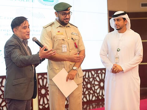 Consul General Paul Raymund Cortes (left), Lieutenant Khalid Mohammad B. Banasser (centre) along with another official at Dubai Police Officers Club in Jaddaf.