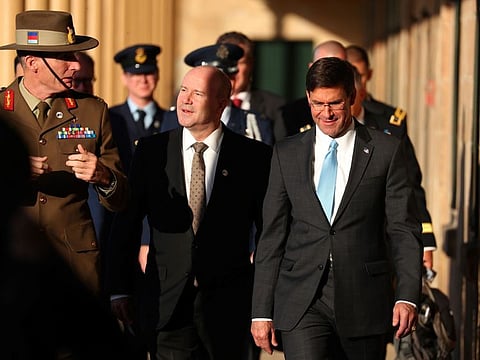 US Secretary of Defense Mark Esper (R) walks with Australia's Chief of the Defence Force General Angus Campbell (L) and Australia's Secretary of the Department of Defence Greg Moriarty at Victoria Barracks in Sydney on August 4, 2019. 