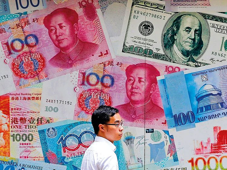 A man walks past a money exchange shop at Central