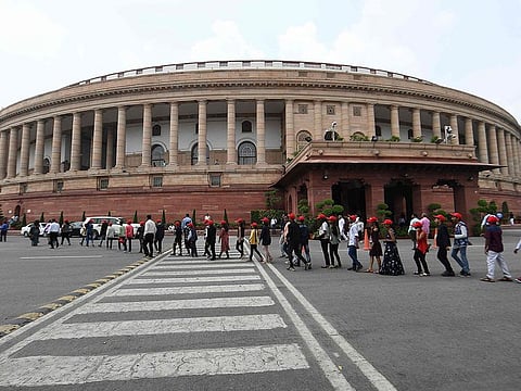 Visitors are seen at the Parliament House in New Delhi on August 5, 2019. The Indian government on August 5 rushed through a presidential decree to scrap a special status for disputed Kashmir, hours after imposing a major security clampdown in the region.