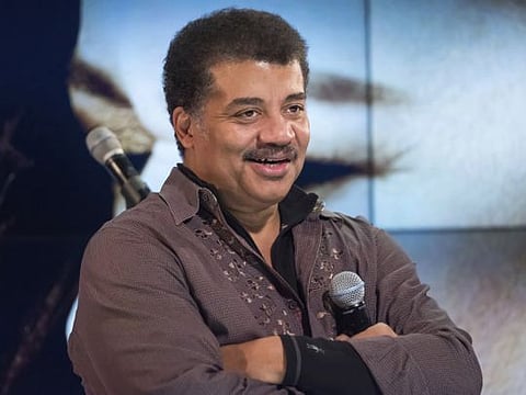 FILE - In this Wednesday, Nov. 1, 2017 file photo, Neil deGrasse Tyson attends a fan event celebrating the release Kelly Clarkson's album "Meaning of Life" at YouTube Space New York in New York. The astrophysicist  will keep his job as head of the Hayden Planetarium at New York’s American Museum after the museum concluded its investigation into sexual misconduct charges against him.  (Photo by Charles Sykes/Invision/AP, File)