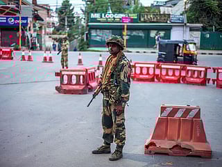 Armed soldiers patrol silent streets after Kashmir curfew