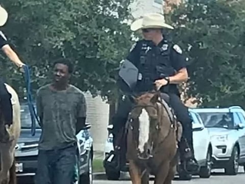 Photo of officers leading black man by a rope in Texas 