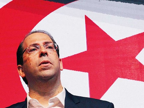 Tunisia's Prime Minister, and head of the Tahya Tunis (Long Live Tunisia) political party, Youssef Chahed announces his candidacy for the presidential elections during a party meeting in Tunis.