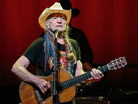 (FILES) In this file photo taken on December 30, 2018, US Country music legend Willie Nelson performs during the "Willie Nelson & Family New Year" concert at Austin City Limits Live in Austin, Texas. Nelson has canceled the rest of his tour set to run for 30 more shows over a breathing problem. "To my fans, I'm sorry to cancel my tour, but I have a breathing problem that I need to have my doctor check out. I'll be back Love, Willie," the 86-year-old tweeted. / AFP / SUZANNE CORDEIRO