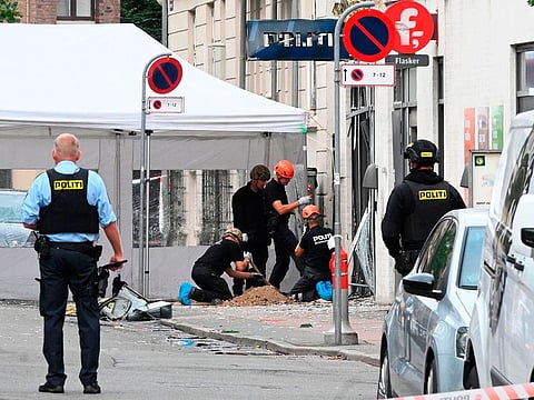 Danish police technicians work inspect the scene on Hermodsgade outside a local police station in Copenhagen on August 10, 2019, after the police station was hit by an explosion in the early morning