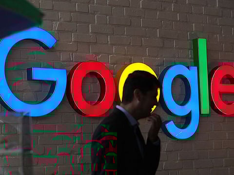 An illuminated Google logo at the company's exhibition stand during the Noah Technology Conference in Berlin.