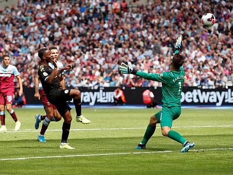 Manchester City's hat-trick hero Raheem Sterling scores their third goal against West Ham at London Stadium today.