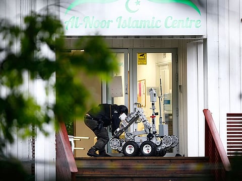 Police attend the scene after a shooting inside the al-Noor Islamic center mosque in Baerum outside Oslo.  