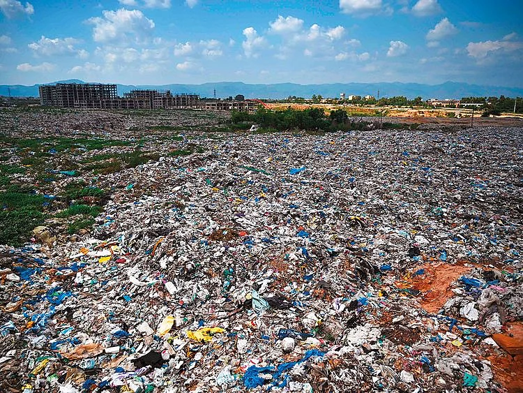 A trash site full of plastic bags on the outskirts of Islamabad