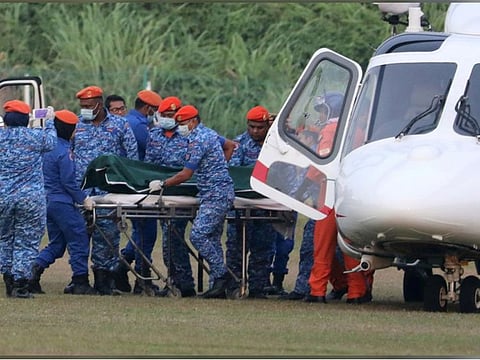 A body believed to be 15-year-old Irish girl Nora Anne Quoirin who went missing is brought out of a helicopter in Seremban, Malaysia, August 13, 2019. REUTERS/Lim Huey Teng