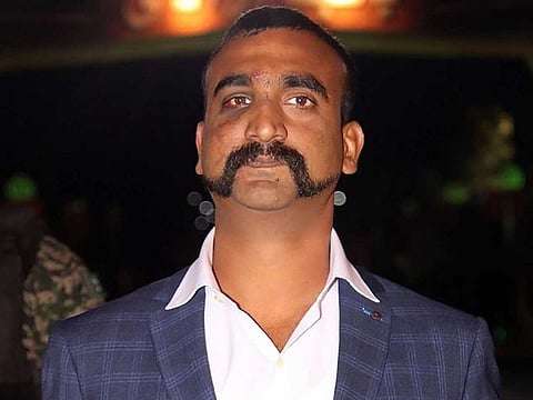 Indian Air Force pilot Wing Commander Abhinandan Varthaman is seen in this March 1, 2019 file photo, as he is released by Pakistani authorities at Wagah border on the Pakistani side. Varthaman spent some days in Pakistani custody when his MiG-21 was shot down in a dogfight with PAF jets a day after the February 26 Balakot airstrike. He will likely be conferred the Vir Chakra on Indian Independence Day. 