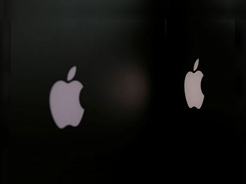 File photo: Apple company logos are seen as two MacBooks stand next to each other in an office in Vienna, Austria January 3, 2019. REUTERS/Leonhard Foeger