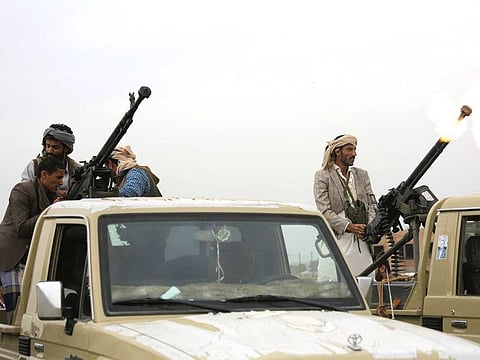 A Houthi fighter fires in the air during a gathering aimed at mobilising more fighters for the their movement, in Sanaa, Yemen.