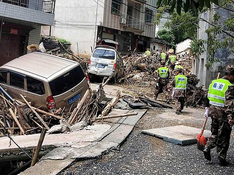 Rescuers working in the aftermath of Typhoon Lekima in Linan in China's eastern Zhejiang province