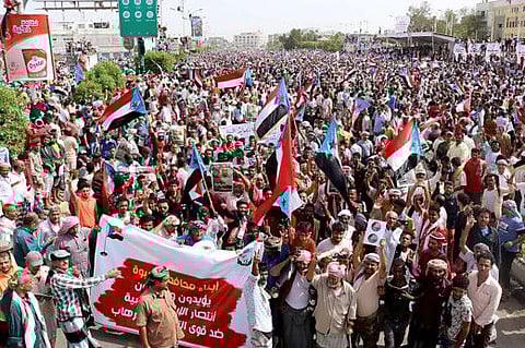 Yemeni Southern Transitional Council supporters wave flags of the former South Yemen (The People's Democratic Republic of Yemen) as they demonstrate in the Khormaksar district of Yemen's second city of Aden on August 15, 2019. 