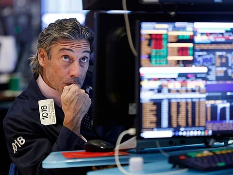 A trader works on the floor of the New York Stock Exchange, on Wednesday, Augst 14, 2019. 