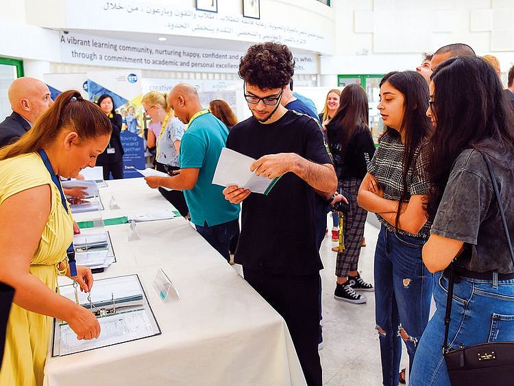 Students check out their A Level results at GEMS Jumeirah College in Dubai