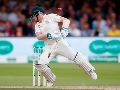 Australia's Steve Smith is hit on the neck with a ball bowled by England's Jofra Archer. 