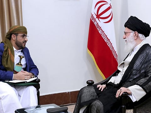 In this picture released by an official website of the office of the Iranian supreme leader, Supreme Leader Ayatollah Ali Khamenei, right, listens to Mohammed Abdul-Salam, spokesman for the Yemen Houthis rebels during their meeting at his residence in Tehran, Iran, Tuesday, Aug. 13, 2019. 