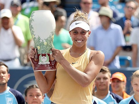Madison Keys poses with the trophy.