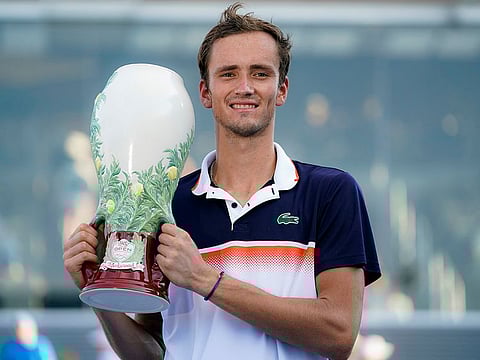 Daniil Medvedev of Russia holds the Rookwood Cup after winning in Cincinnati.