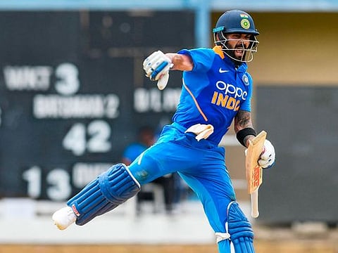 Virat Kohli celebrates his century during the 2nd ODI match against West Indies at Queens Park Oval in Port of Spain, Trinidad and Tobago, on August 11, 2019. 