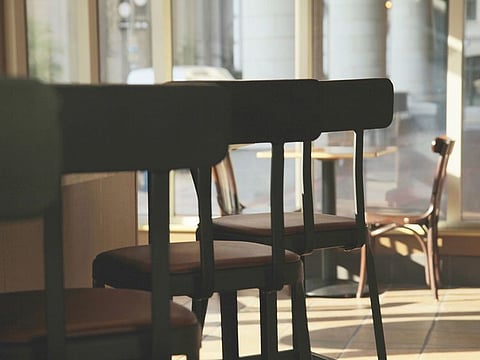 Empty chairs at a restaurant. For illustrative purposes only.