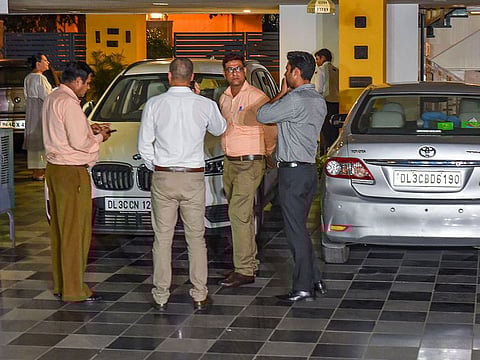 Enforcement Directorate officials at the residence of Congress leader P. Chidambaram during a raid in Jor Bagh in New Delhi.