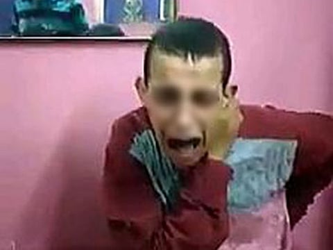 A screen grab of video of assault of mentally challenged boy.