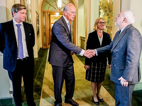 Iran's Foreign Minister Javad Zarif (R) meets with (L-R) Christian Tybring-Gjedde, Michael Tetzschner and Anniken Huitfeldt, all members of the Standing Committee on Foreign Affairs and Defence in the Norwegian Parliament, during his visit in Oslo on  August 22, 2019. 