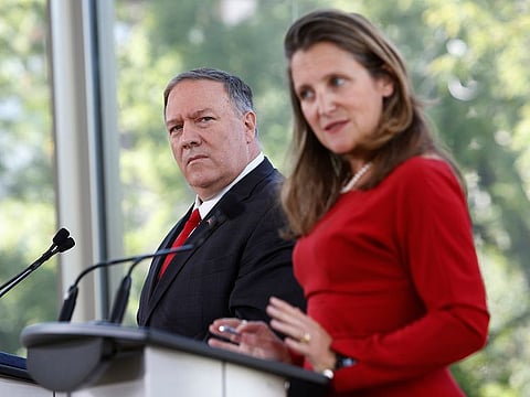 Mike Pompeo, US secretary of state, left, listens while Chrystia Freeland, Canada's foreign minister, speaks during a joint press conference at the National Arts Centre in Ottawa, Ontario, Canada, on Thursday, Aug. 22, 2019.