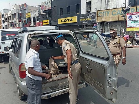  Policemen check a vehicle after intel of Lashkar terrorists' intrusion, in Coimbatore, Friday, Aug 23, 2019. 