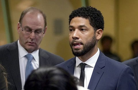 FILE - In this March 14, 2019 file photo, "Empire" actor Jussie Smollett, stands before Cook County Circuit Court Judge Steven Watkins where he pled not guilty at the Leighton Criminal Court Building,  in Chicago.