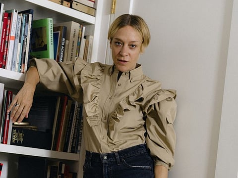 The actress Chloë Sevigny at her home in New York, Aug. 2, 2019. Sevigny, the art house queen and fashion muse, has some things to say about a red lip, unruly brows and how she gave a cool girl spin to her new rose perfume. (Molly Matalon/The New York Times)