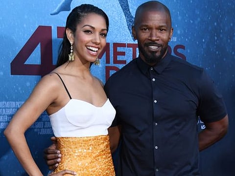 US actress and model Corinne Foxx (L) and her father US actor Jamie Foxx attend the premiere of "47 Meteres Down: Uncaged" at the Regency Village Theatre in Westwood, California on August 13, 2019.