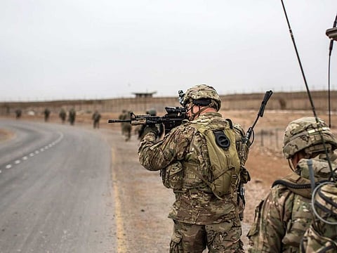 US soldiers conduct a dismounted patrol around Tarin Kowt, Afghanistan.