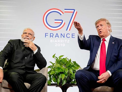 US President Donald Trump, accompanied by Indian Prime Minister Narendra Modi, left, speaks during a bilateral meeting at the G-7 summit in Biarritz, France, Monday, Aug. 26, 2019. 