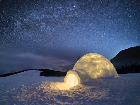 Night landscape with a snow igloo with light. Extreme house. Winter in the mountains. Sky with the stars and the Milky Way (Night landscape with a snow igloo with light. Extreme house. Winter in the mountains. Sky with the stars and the Milky Way, ASC