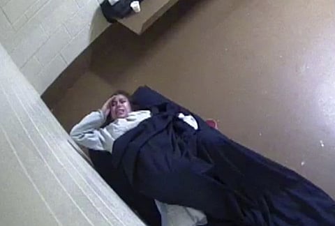This photo from surveillance video released to Killmer, Lane & Newman, LLP law firm by the Denver City Jail shows Diana Sanchez, an inmate about to give birth alone in her Denver jail cell. 