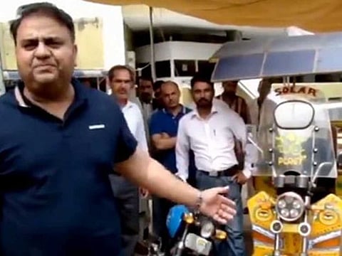 Pakistan Minister for Science and Technology explaining about the newly developed electric motorcycles and rickshaws being introduced in Pakistan.