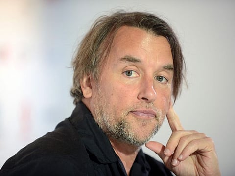(FILES) In this file photo taken on July 1, 2018, US film director and producer Richard Linklater addresses a press conference at the 53rd Karlovy Vary International Film Festival in Karly Vary, Czech Republic.  Linklater, known for his wildly ambitious projects, has announced that his latest movie will be filmed over a 20-year span. Linklater famously shot his Oscar-winning "Boyhood" over 12 years, allowing its star Ellar Coltrane to naturally age on screen from a five-year-old up to his first day of college. / AFP / Michal CIZEK