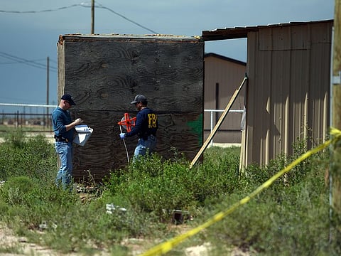 FBI agents investigate the home of Seth Ator following the shooting he committed, according to the local police, in Odessa, Texas, U.S. September 1, 2019.