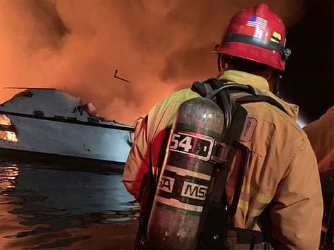 A commercial scuba-dive boat sank amid intense flames early Monday off the coast of Southern California and 34 passengers were unaccounted for, the US Coast Guard said.